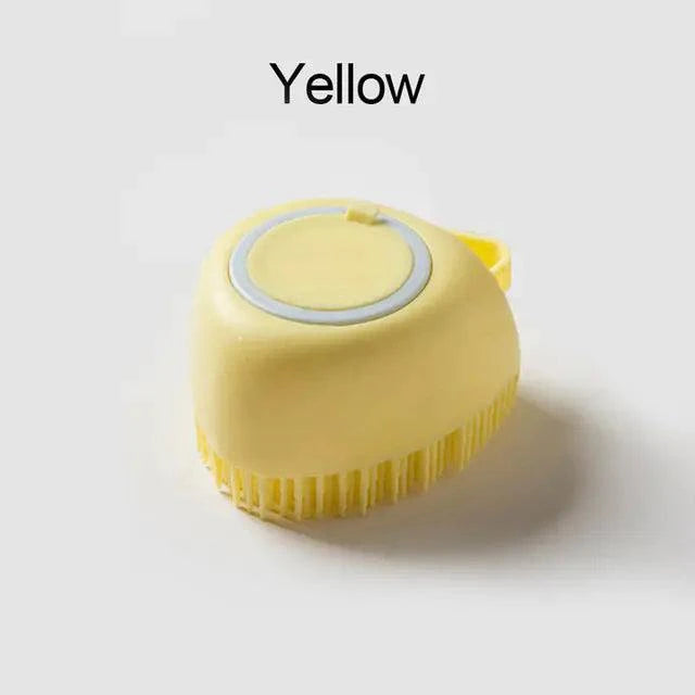 Soft silicone dog brush in yellow with gentle bristles and built-in shampoo dispenser for pet grooming