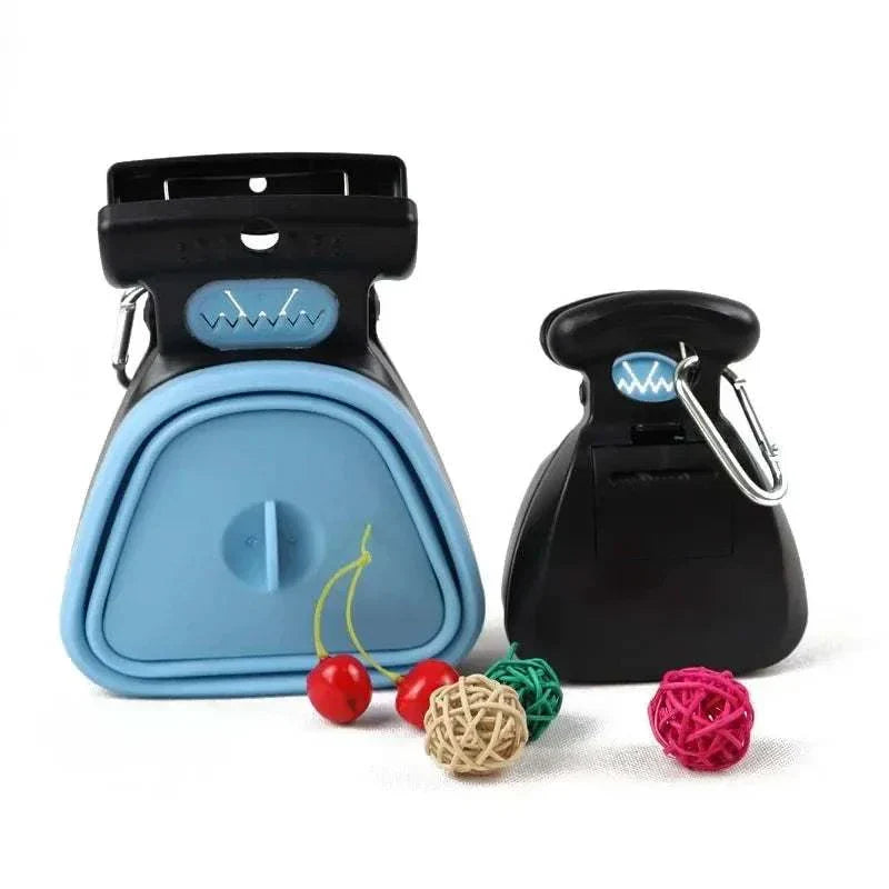 Portable folding dog poop scooper in blue and black with carabiner clips for easy carrying