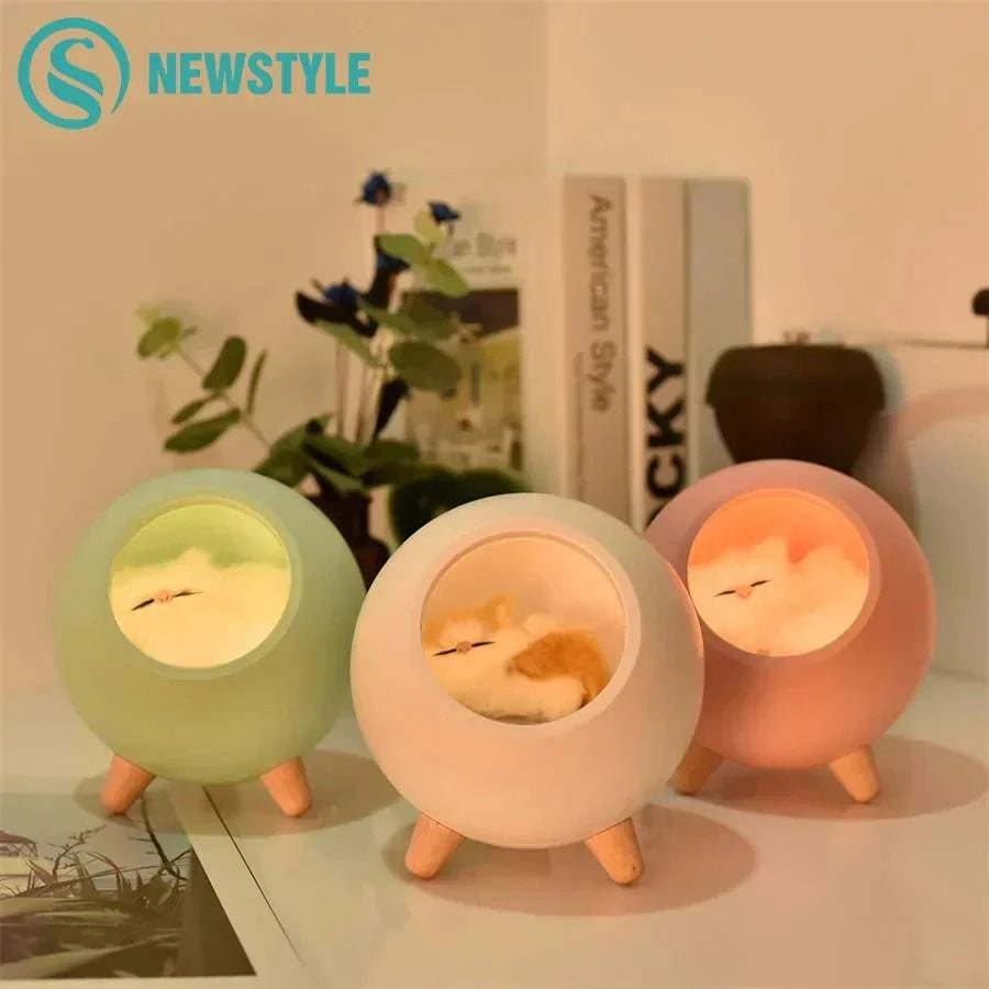 LED cat light night lamp with warm yellow glow and adjustable brightness in spherical design with wooden legs