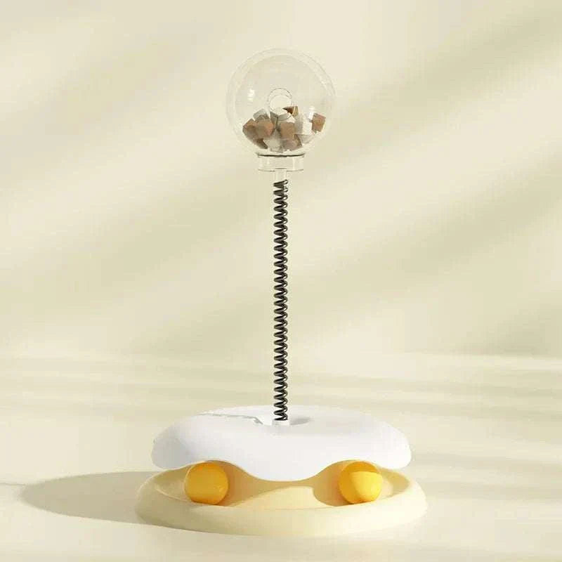 Leaking Treats Ball pet feeder toy with treat-dispensing ball on spring base for interactive play and mental stimulation