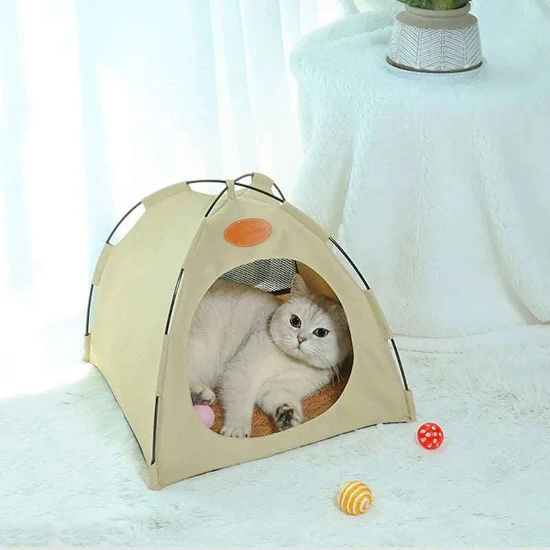 Foldable pet tent with beige fabric and mesh windows, cozy indoor shelter for cats and small pets, portable and easy to set up.
