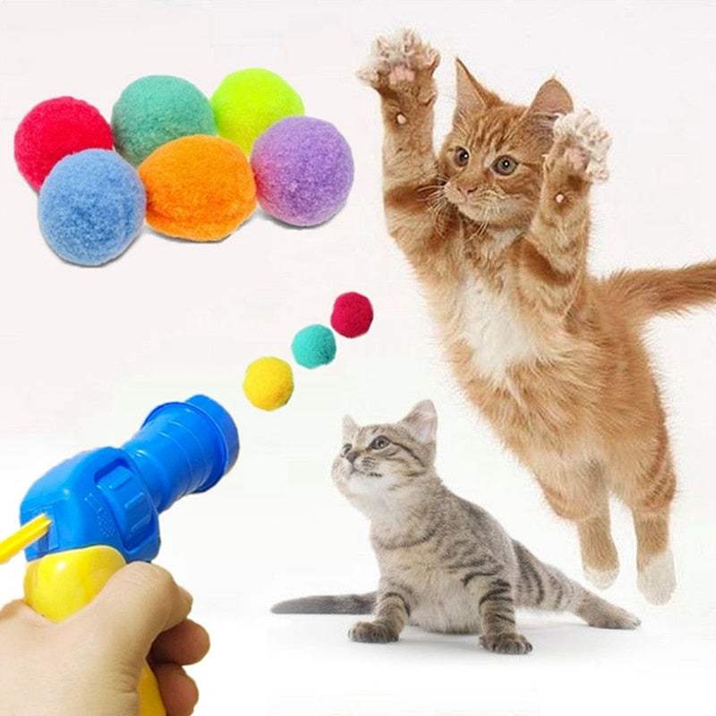 Automatic Ball Launcher playing with cats and colorful soft balls for pet exercise and entertainment