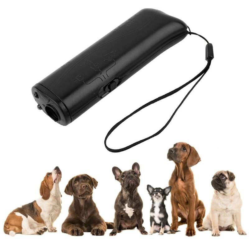 Black portable dog training device with wrist strap and various dog breeds sitting in a row