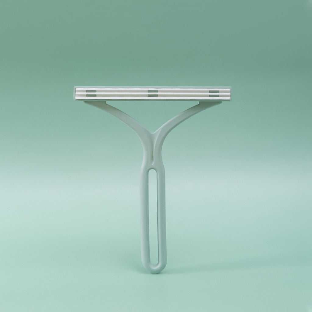 Double ended manual pet hair lint remover with stainless steel teeth for detailed grooming and tear stain removal