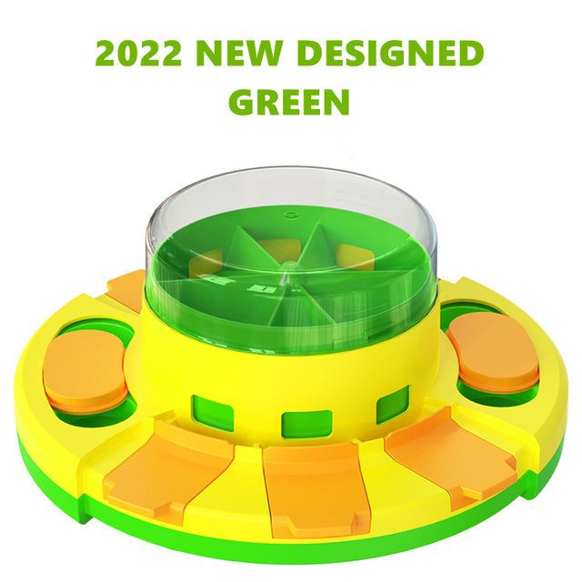 Interactive puzzle toy for dogs with multiple compartments and a clear food dispensing cover in green and yellow colors