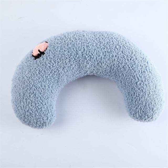 Soft blue U-shaped CatCozy pillow for cat comfort and cervical support