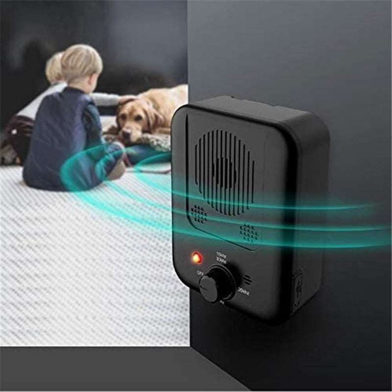 Black anti-bark device mounted on wall emitting high-frequency sound to train dogs peacefully