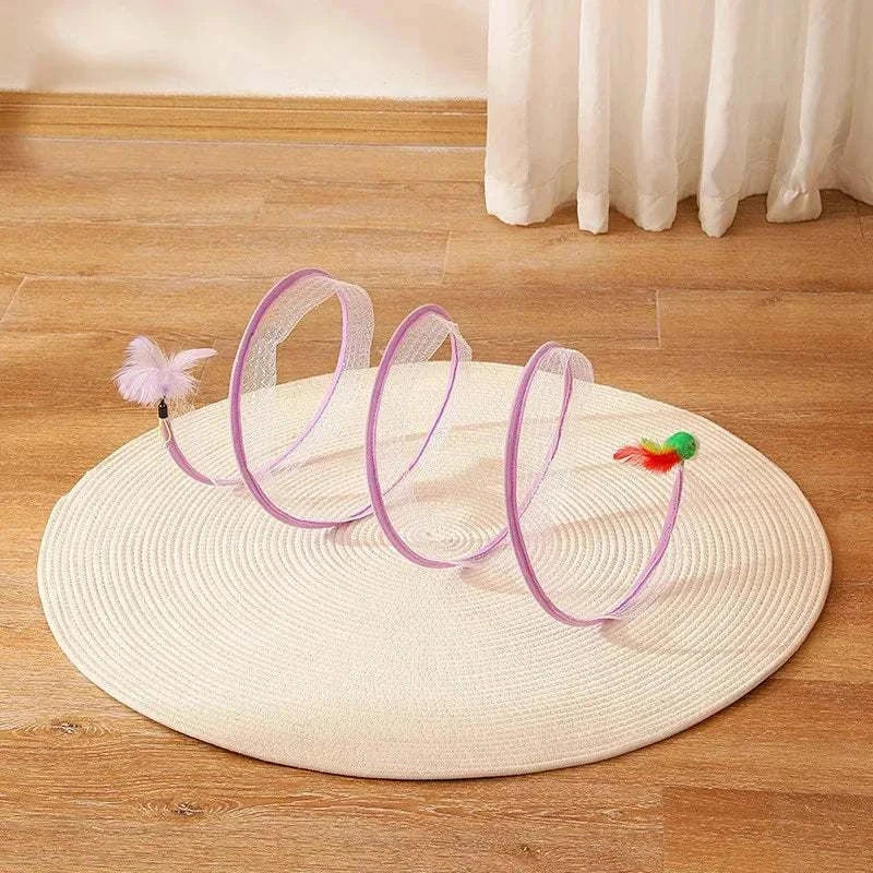 Self-play Cat Hunting Spiral Tunnel Toy with feather and ball on beige rug for cat exercise and playtime
