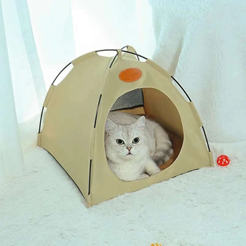 Foldable pet tent with cozy interior and mesh windows for ventilation, featuring a beige durable design with a cat inside.