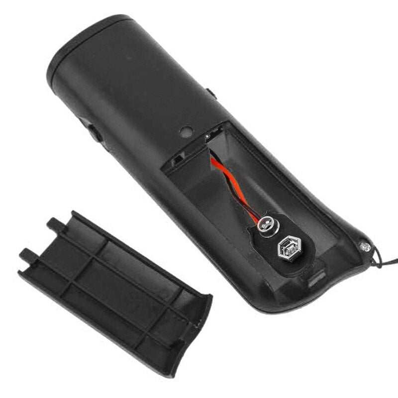 Black compact dog training device with ultrasonic bark control and removable battery cover