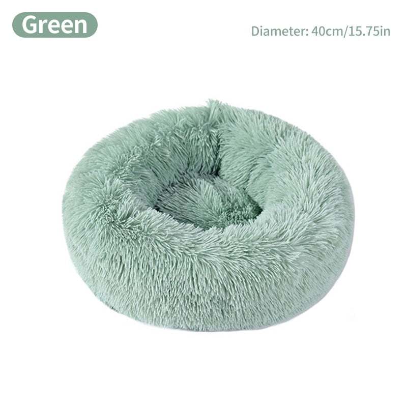 Green calming pet bed round donut shape with high loft polyester fill for small dogs up to 25lbs