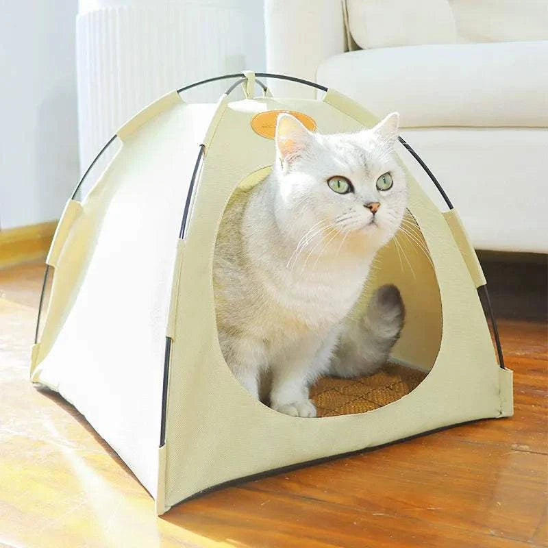 Foldable pet tent with beige fabric and mesh windows, cozy shelter for cats and small pets, portable and easy to set up.
