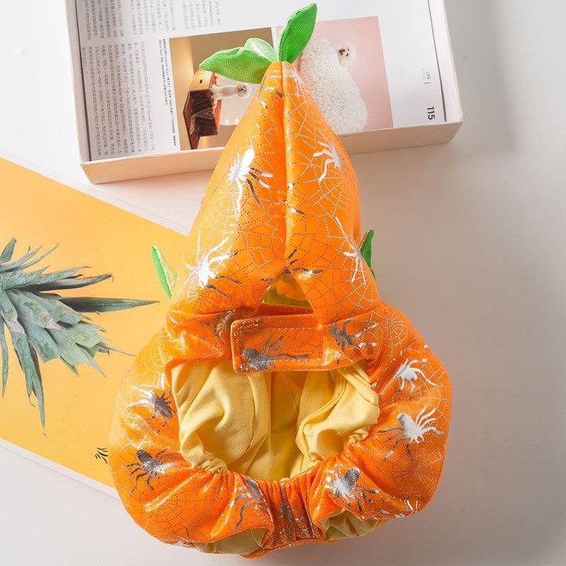 Orange dog pumpkin Halloween costume with spider web design and green leaf accents for small to large dogs