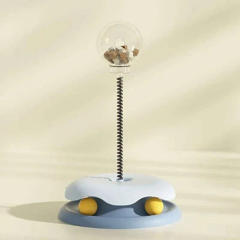 Leaking Treats Ball pet feeder toy with treat-dispensing ball on spring and interactive base