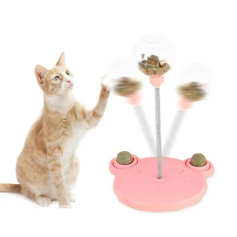 Cat playing with Leaking Treats Ball pet feeder toy dispensing treats for mental stimulation